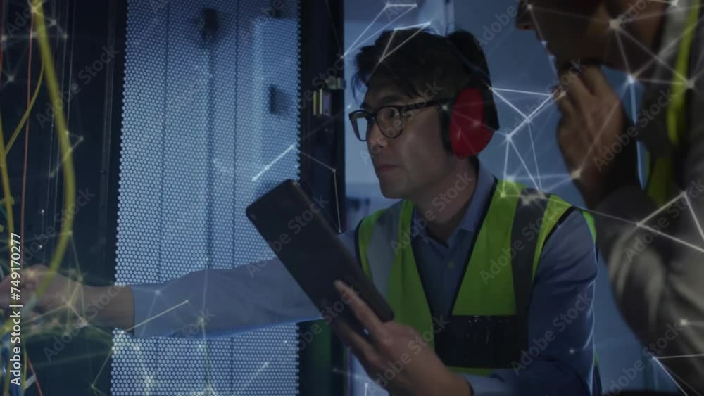 Poster animation of shapes moving over diverse workers using tablet in server room