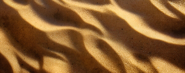 Close-up of summer beach sand patterns, perfect for tranquil vacation vibes