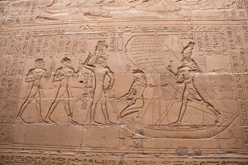 Fototapeta na wymiar Ancient egyptian carvings and hieroglyphs at the temple of Horus in Edfu, Aswan, Egypt 