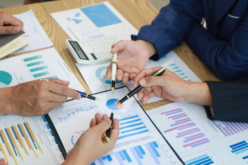 Close-Up Hand Business People Meeting Agenda at Desk, Stock Trends