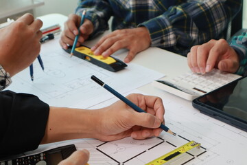Engineer Team Meeting at Desk: Construction Cost Planning Hands Close-Up