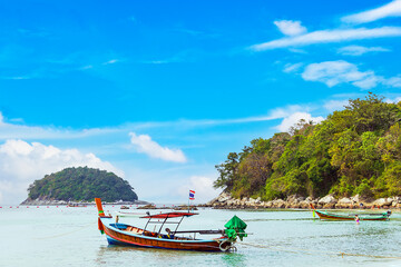 Kata beach with boat and blue sky in Phuket Thailand