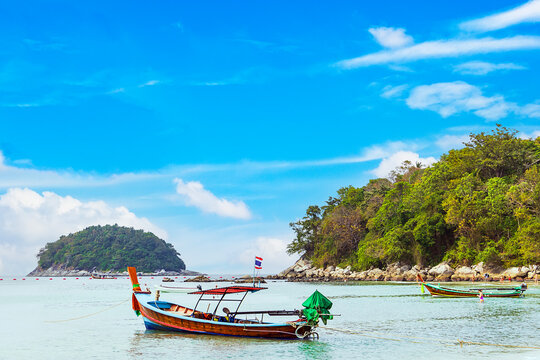 Kata beach with boat and blue sky in Phuket Thailand