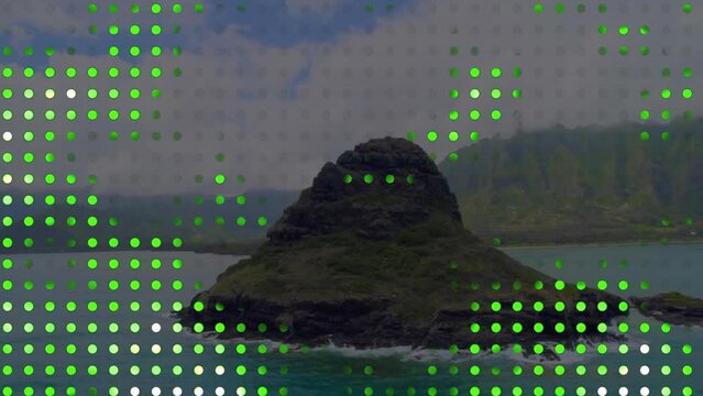 Animation of green spots over rock on sea