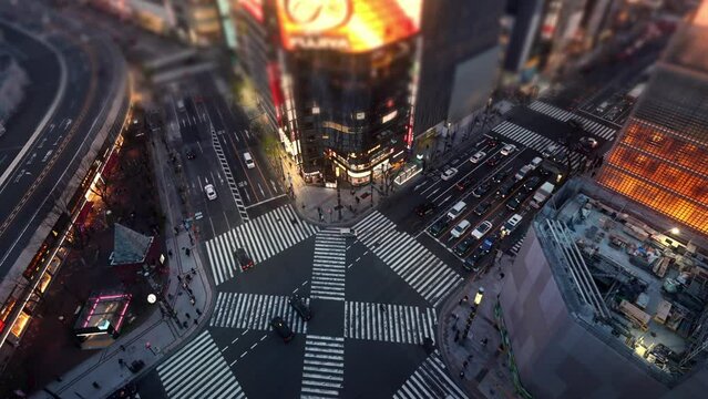 city crossroads aerial view, time lapse of busy intersection with pedestrian crossing and cars in Tokyo, Shibuya Crossing, city life, crowded city road