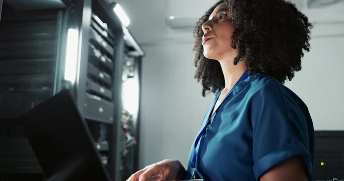 Smile, technician and woman on laptop in data center for cyber security, thinking and update database. Happy engineer, computer or server room for typing, problem solving and information technology