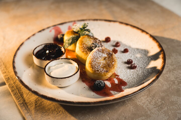 Homemade cheesecakes with sour cream and jam. Diet food concept. 4k