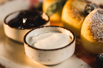 Homemade cheesecakes with sour cream and jam. Diet food concept. 4k