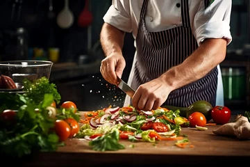Fotobehang Closeup of male hands preparing salad in the kitchen © Shipons Creative