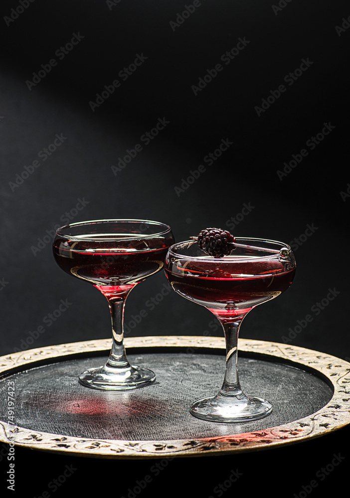 Wall mural cocktail with juice decorated with blackberries