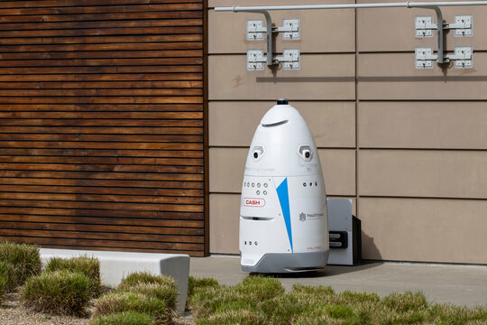 South San Francisco, CA, USA - Feb 23, 2024: Knightscope K5 autonomous security robot is seen at its charging station in the Cove at Oyster Point, a business park in South San Francisco, California.