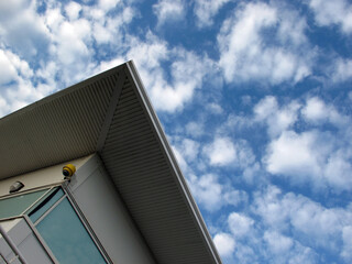 Modern building with blue sky and clouds