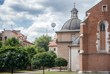 Fototapeta na wymiar Historic Krakow Skyline: Church Domes and Hot Air Balloon