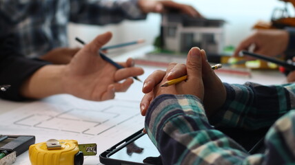 Closeup of hands engineer and architect team discussed about construction and architectural...