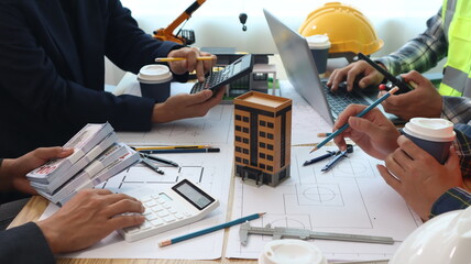 Closeup of hands engineer and architect team discussed about construction and architectural...