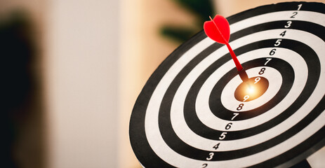 Red dart hitting on the target center dartboard, Business targeting or goal success and winner...