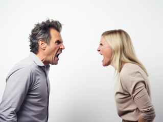 Mid aged couple yelling at each other isolated on white, studio shot, concept for marriage problem, temper control and human relationships. 