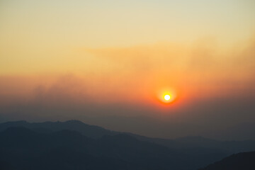 landscape and travel concept with sunset and twilight sky with layer of mountain