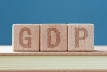 Letter block GDP on blue background
