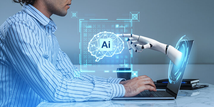 Man with laptop, AI brain and robot hand