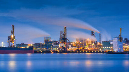 Heavy industry. View of production and factory. Panoramic view of the factory at night. Emission of...