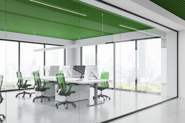 Modern office interior with chairs and pc monitors in row, panoramic window