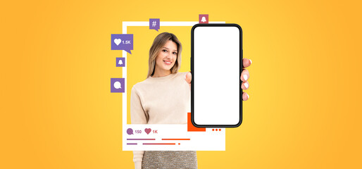 Happy woman showing phone with blank screen and social media icons