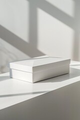 Minimalist Packaging Showcase: High Fidelity Mockup Featuring Rectangular White Cardboard Box, Studio Setup with Cinematic Lighting and Design Interior Setting