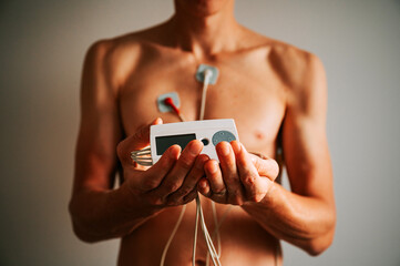 Sunlit heart symphony: A young man's body adorned with an EKG, capturing the intricate dance of cardiovascular rhythms