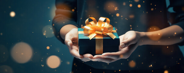 Person Holding a Present in Their Hands - obrazy, fototapety, plakaty