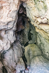 Cave entrance in the bottom of the mountain, Durmitor, Montenegro