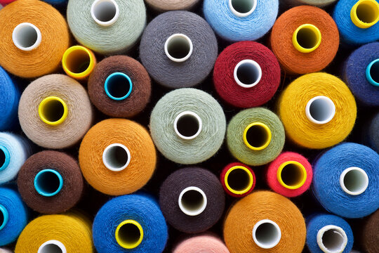 Close-up of multicolored sewing thread spools