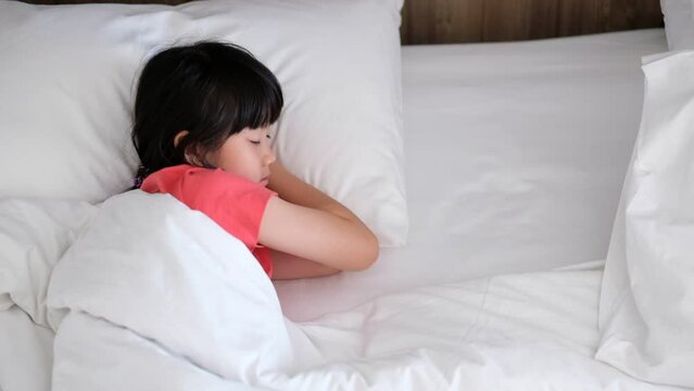 asian kid sleep on bed, sick child
