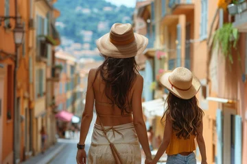 Fototapete Heringsdorf, Deutschland A sightseer and her child strolling through the petite roads of Nice, France. Family holiday idea.