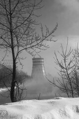 Nuclear power plant in the winter, black and white photo.