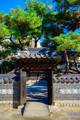 Gate and entrance to traditional Korean house at the folk village park in Seoul, South Korea