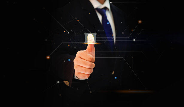 Thumb Print Touching the Screen with glowing lights and blur backdrop. Man wearing tie and touching the thumb on screen