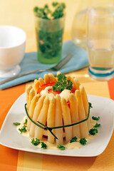 Timbale with asparagus and tomatoes.