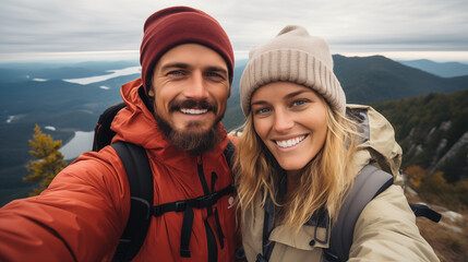 Happy Couple Trekking Reaches Mountain Summit, Taking Selfie: Adventure and Joyful Exploration