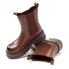 Women leather brown boots on white background