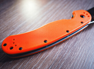 Orange handle of hand knife object background