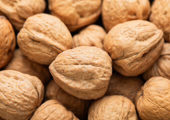 Raw healthy shell walnut nuts top view macro background.Top view.