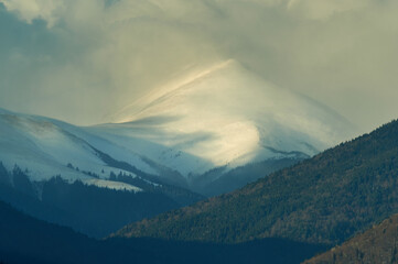 Steep mountain top covered by snow