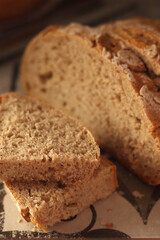 A loaf of rye bread in low key