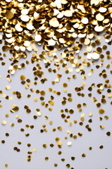 Golden Confetti Celebration on Light Background