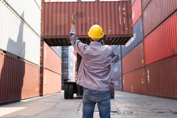 Asia logistic engineer man worker or foreman working direct driver forklift container at container site	