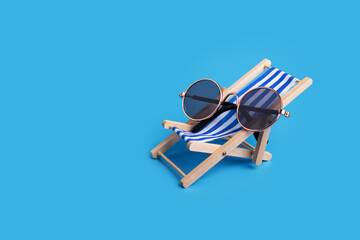 Deckchair with sunglasses, seaside sunbed, travel leisure