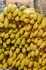 Yellow sorted bananas in a market