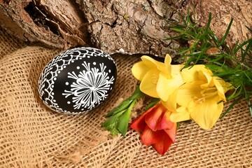 Easter - cheerful colorful Easter eggs - Czech tradition of decorating with wax,still life with Easter eggs and spring flowers,