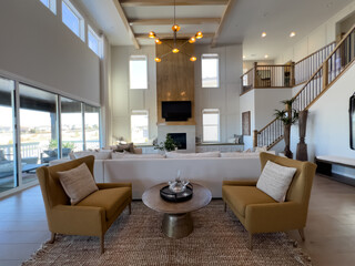 High Ceilings and Warm Tones in a Luxurious Open Living Space